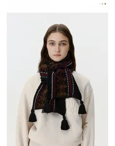 Close-up of Fair Isle knit scarf featuring vintage geometric patterns and black tassels