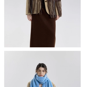 Close-up of sky blue striped wool scarf with fringe and vintage khaki blazer jacket