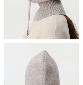 Macro detail of ribbed knit balaclava showing high-quality wool texture and stitching