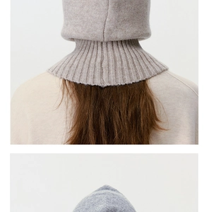 Detail of knitted balaclava showing back fit and long ribbed neck coverage in beige and gray