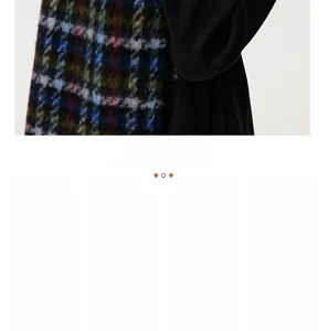 Detailed close-up of plaid cashmere scarf fabric texture and high-quality wool tassel detail