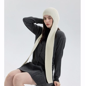 Detail of white ribbed knit balaclava hooded scarf showing the vertical texture and long drapes