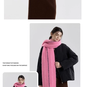Detail of pink wool knit scarf with grey stripe and soft fuzzy mohair texture