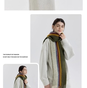 Detail of wool blend striped scarf showing colorful knit texture and long tassels