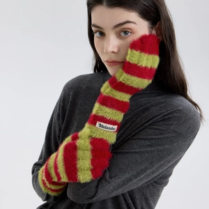 Plush red and green striped arm warmers with soft fur texture and brand label