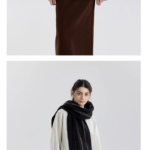 Detailed view of striped wool tassel scarf styled with minimalist autumn knitwear