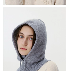 Detailed close-up showing soft ribbed knit texture and adjustable drawstring of the gray hood