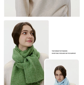 Close-up of premium knit wool scarf texture in sage green and light blue colors
