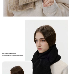 Close-up of knit wool scarf showing thick ribbed texture and fringe edge detail