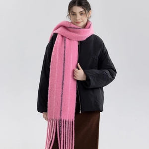 Pink wool knit scarf with black vertical stripes and long fringe for winter style