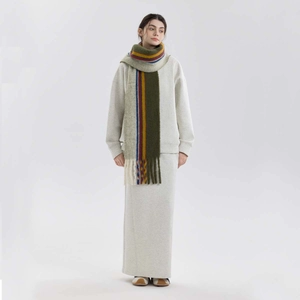 Wool blend plaid scarf with tassels styled with beige sweatshirt and skirt outfit
