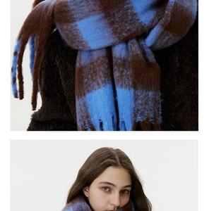 Close-up of blue and brown checkered scarf showing soft plush mohair texture and patterns