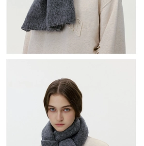 Close-up of deep gray wool blend scarf with a soft, fuzzy knit texture for winter