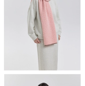 Detail of pink fleece scarf with premium scalloped stitched edges and soft wool texture