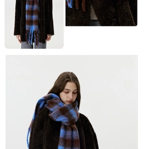 Detailed view of blue and brown checkered mohair scarf styled with teddy coat