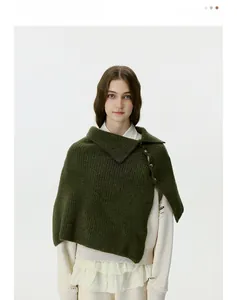Detailed knit texture of dark green buttoned shawl with vertical stripe pattern