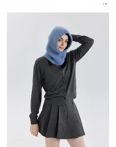 Detail view of light blue wool blend balaclava with vertical ribbed knit texture and fit