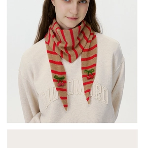 Close-up of wool knit striped scarf with 3D cherry embroidery and bead details