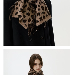Detail of leopard print knitted scarf paired with a wool double-breasted coat