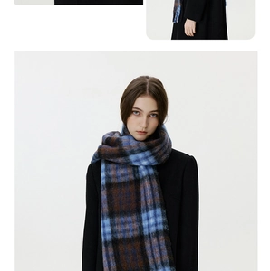 Detailed texture of blue and brown checkered thick winter scarf with soft wool-like finish