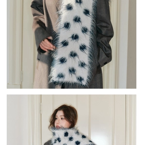 Detailed macro view of soft faux fur scarf with blue polka dots and smooth texture