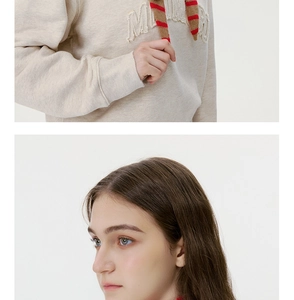Detail showing high-quality knitted wool texture and 3D chenille embroidery on the fabric