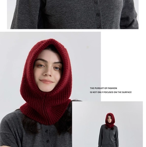 Detail of burgundy ribbed wool knit balaclava hood with buttons and thick texture