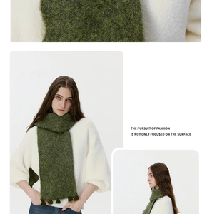Detail of green mohair knit scarf with fringe and soft fluffy texture for winter