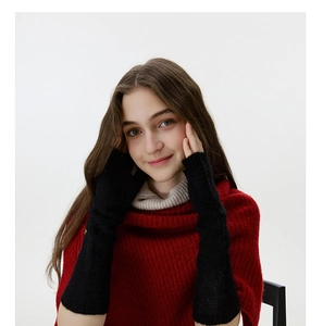 Detail shot of black knitted arm warmer texture and soft woolen fabric for winter wear