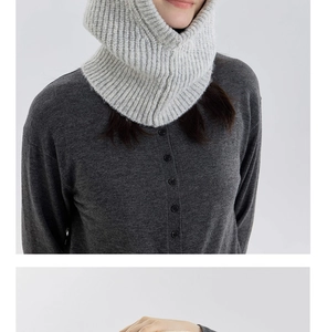 Close-up of light grey wool blend balaclava showing thick ribbed knit texture and hood details