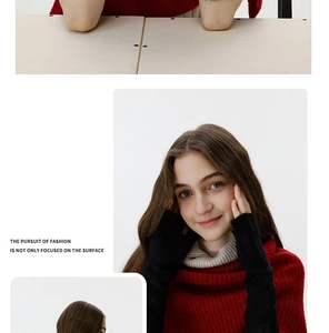 Detail of red chunky knit turtleneck sweater paired with black knitted arm warmers