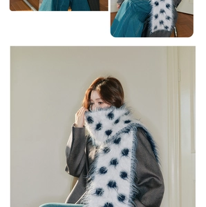 Detailed macro view of soft wool scarf with thick jacquard knit and retro navy polka dots