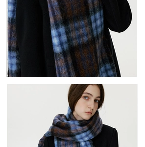 Detail of blue and brown checkered scarf with soft brushed texture and vintage plaid pattern