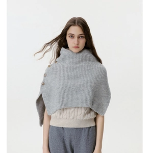 Detailed view of light gray ribbed knit neck warmer with side button high collar design
