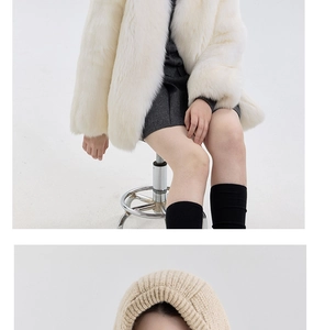 Detail of wool blend knitted balaclava paired with a white faux fur coat for winter