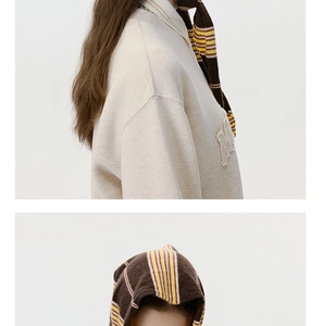 Macro detail of brown striped knit scarf texture and premium wool blend material