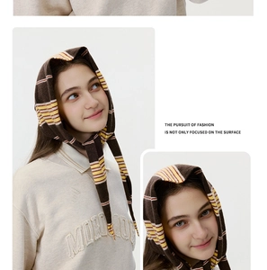 Detail shot of striped knitted headscarf showing soft texture and vintage striped pattern