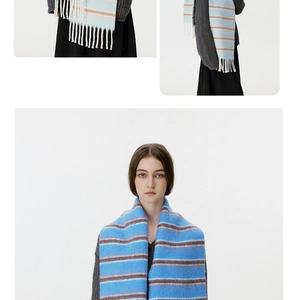 Detail of blue and coffee striped wool blend scarf with decorative fringe texture