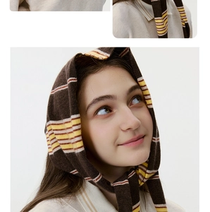 Close-up of brown and yellow striped knit scarf showing premium texture and pattern