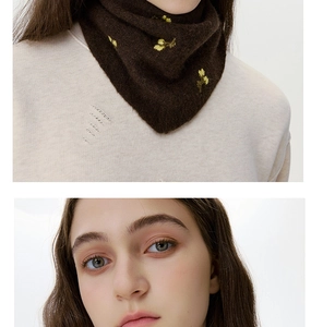 Detailed view of yellow flower embroidery on dark brown wool knit neck gaiter scarf