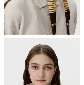 Detailed knit texture and striped polo collar on beige vintage sweater for women