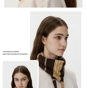 Detail of striped knit shawl scarf in brown and yellow tones on a beige background