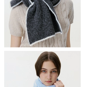 Detailed knit texture of soft wool blend scarves in charcoal grey and light blue colors