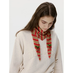 Striped wool knit scarf with cherry sequins and green leaf decor on a cream sweatshirt