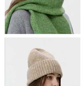 Close-up detail of soft oatmeal knit beanie and grass green thick textured scarf set