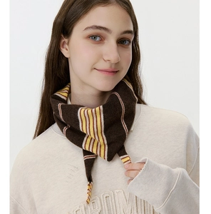 Detail of soft striped knit neck scarf in dark brown with yellow and white accents
