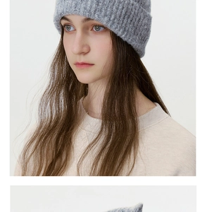 Close-up of grey wool blend knitted beanie featuring a textured vertical ribbed pattern