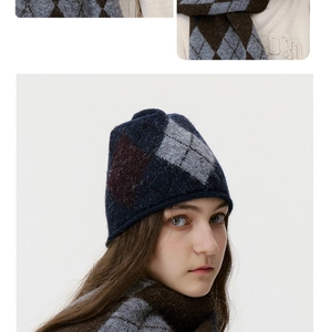 Detail of argyle knit hat and scarf set with blue brown and grey fuzzy texture