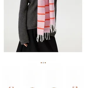 Detail of pink and orange striped wool blend scarf with fringe texture and custom process