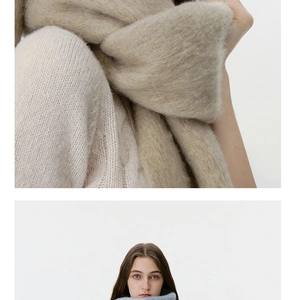 Close-up of oatmeal wool blend scarf texture and soft fringe detail for autumn and winter